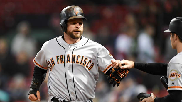 SF Giants catcher Stephen Vogt celebrates with right fielder Mike Yastrzemski after scoring against the Red Sox. (2019)